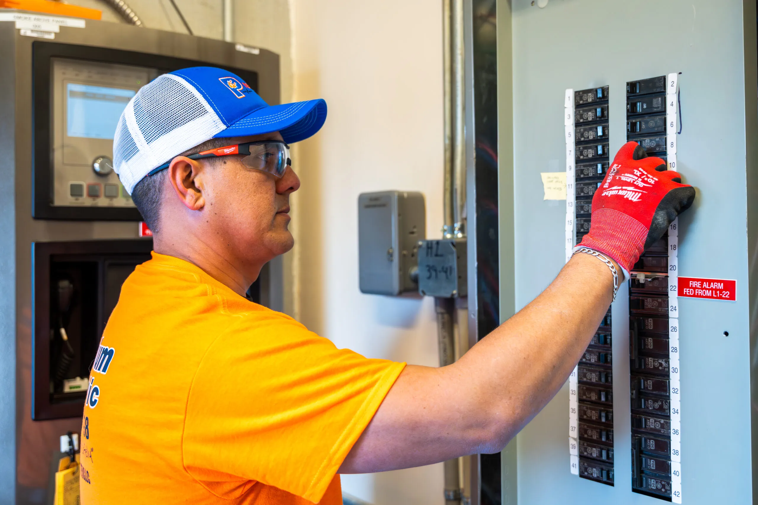 Ronny checking breakers in an open panel